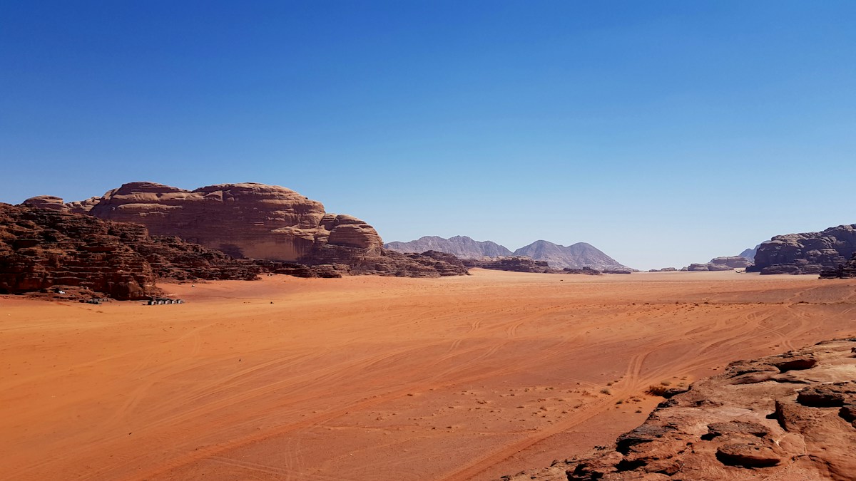 Sandstone mountains and desert sand in Wadi Rum, Jordan